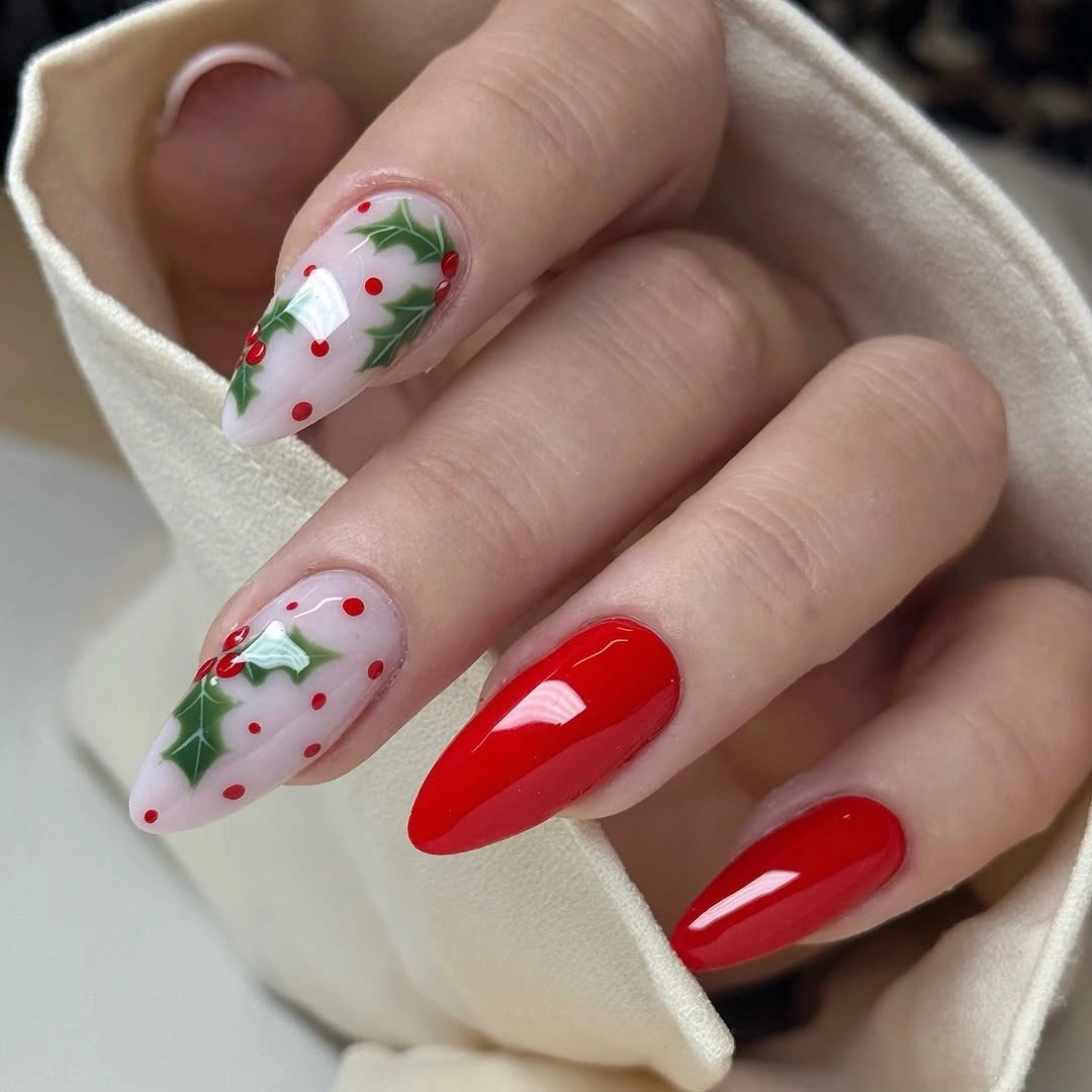 Pointed red nails with holly leaves and red dots