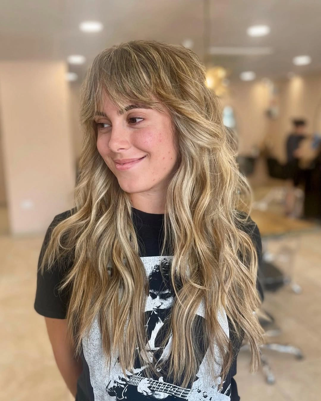Long blonde shag with curtain fringe and layered loose waves
