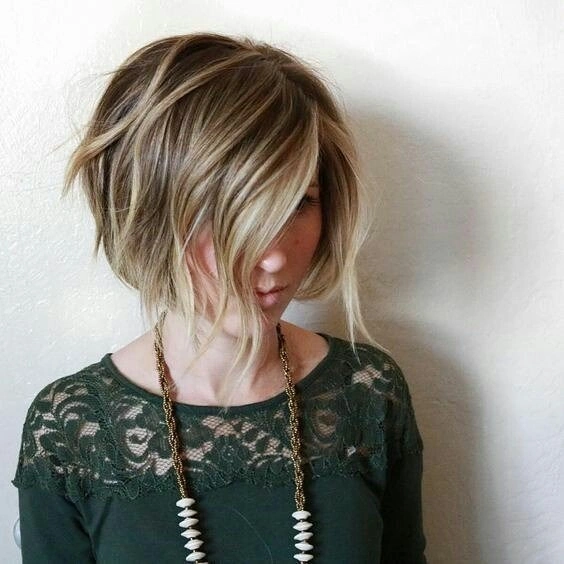 Short graduated blonde bob with rounded back and long front sections