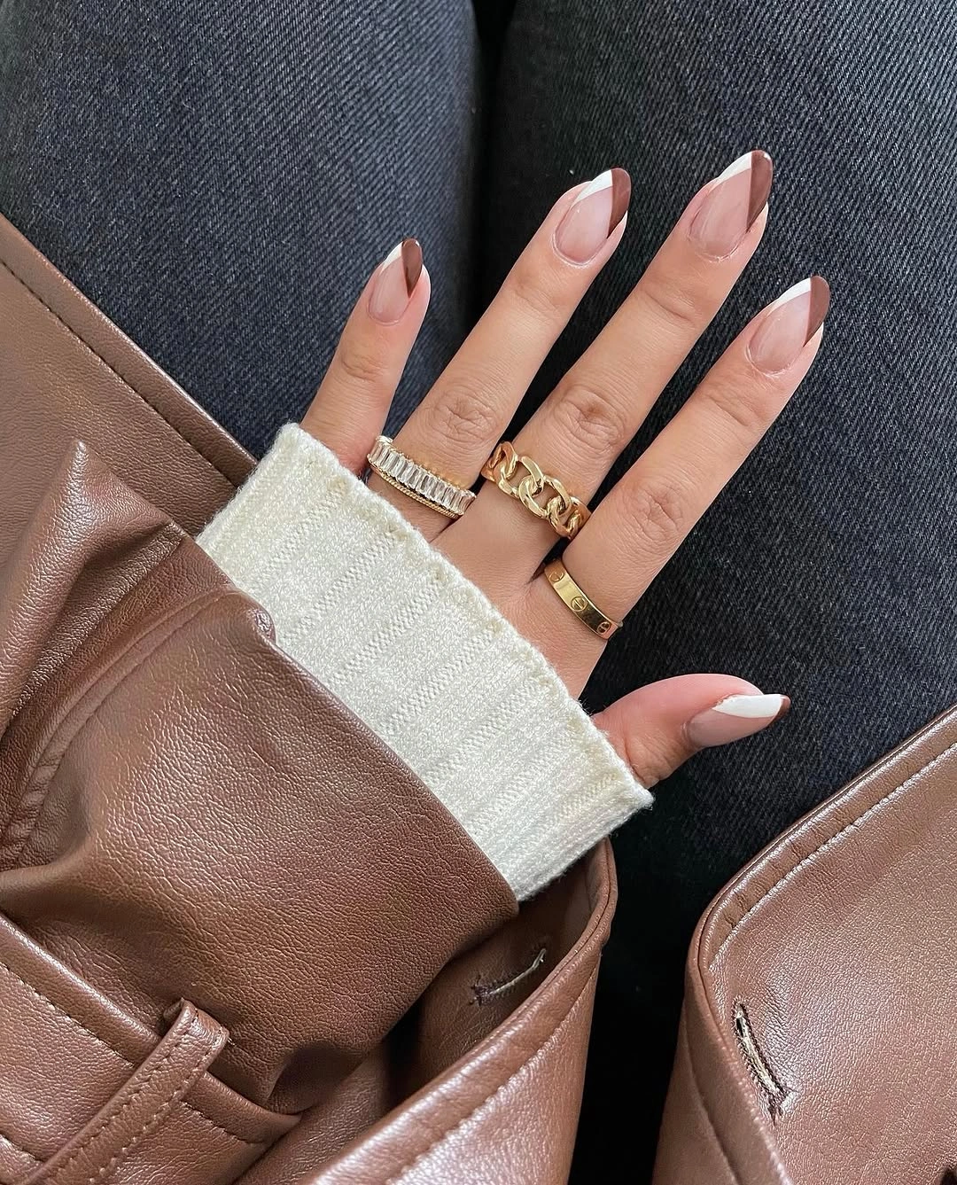 Almond nails with sheer pink bases and white French tips