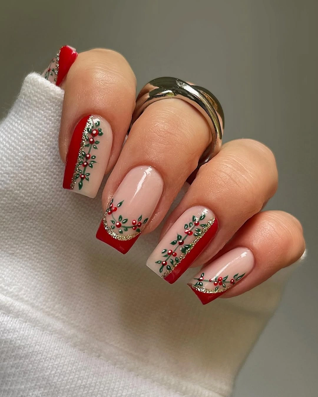 Square nude nails with red borders and green garland lines