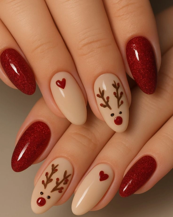 Red glitter almond nails with reindeer and heart accents