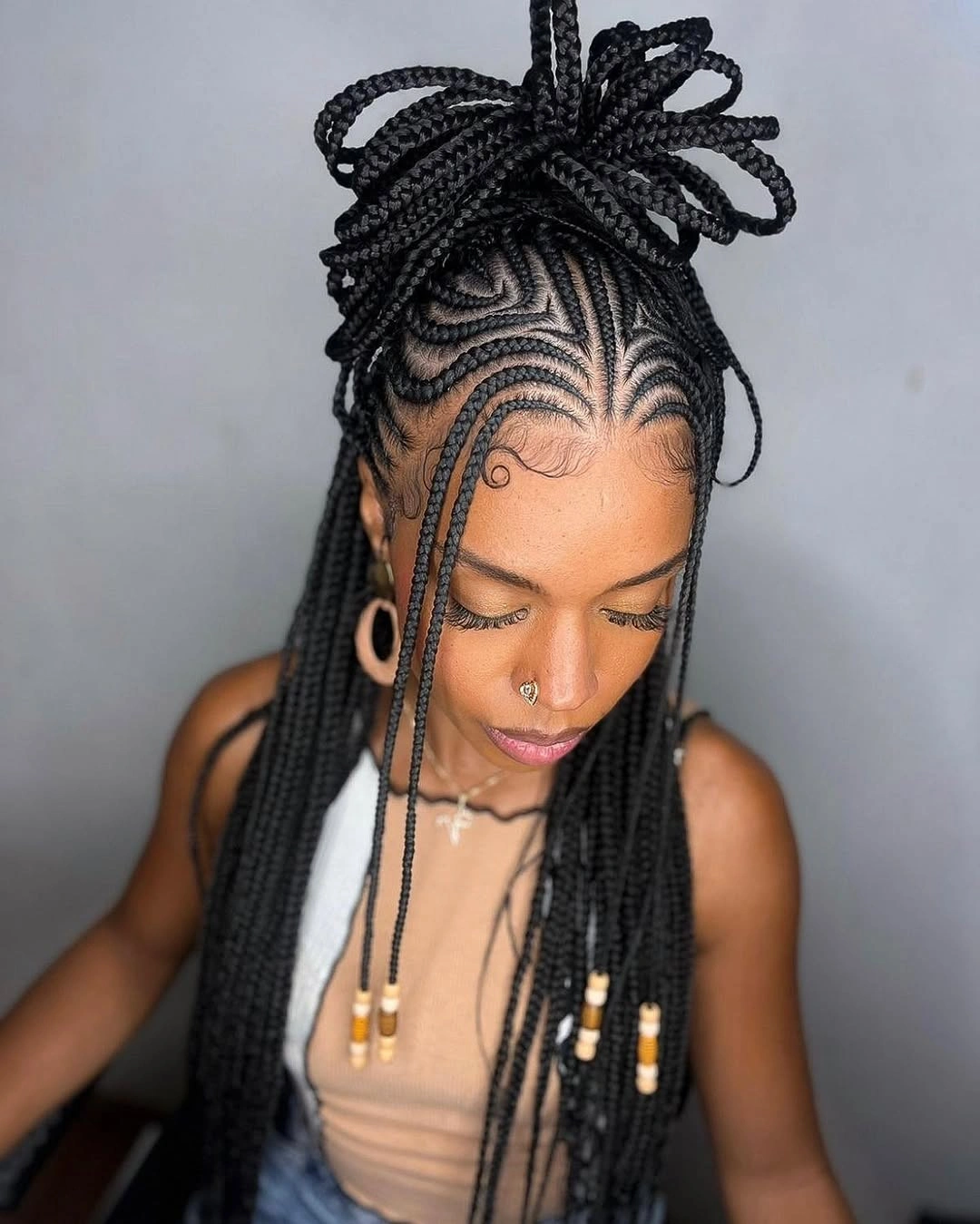 Long braids with looped updo and bead accents