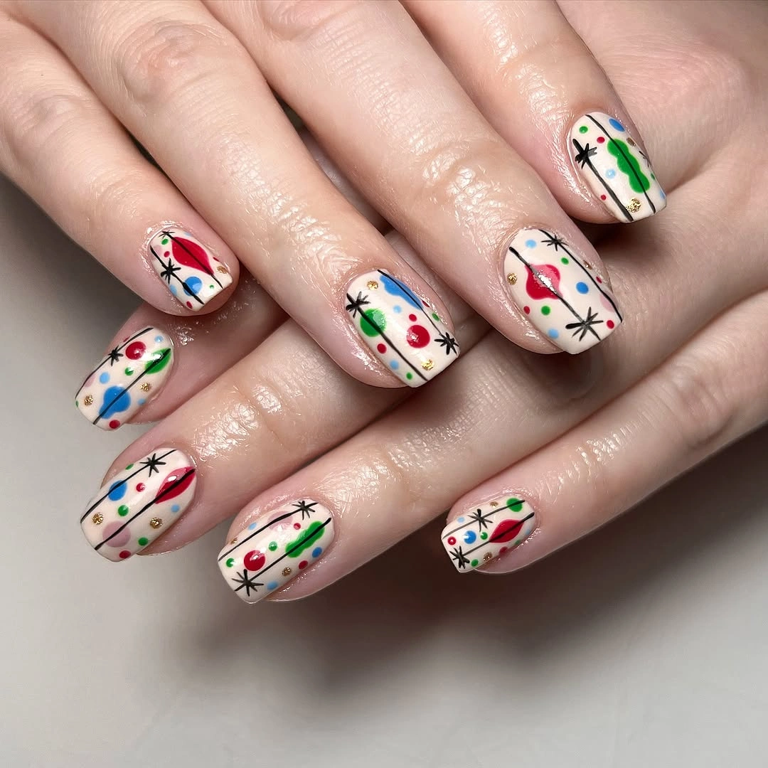 Short cream nails with colorful lights and starbursts