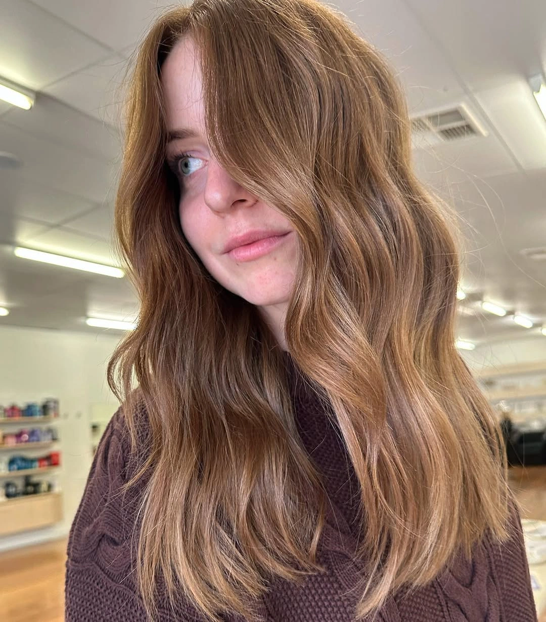 Long medium-brown waves with soft golden-beige ends