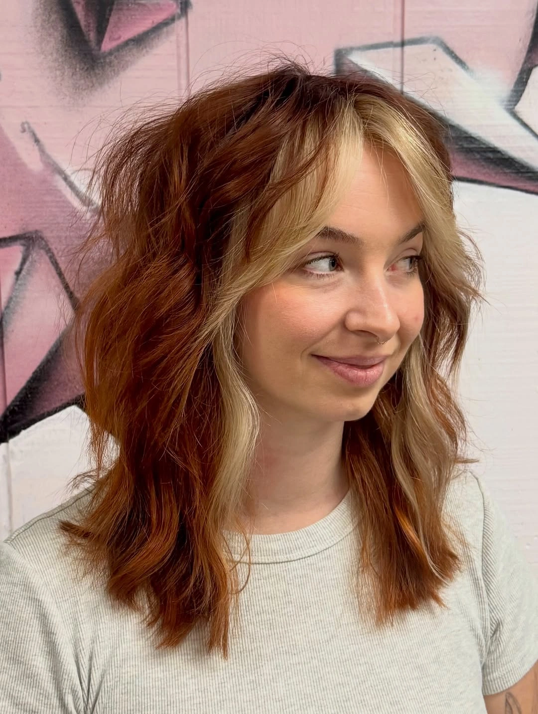 Copper-red hair with thick pale blonde face-framing panels
