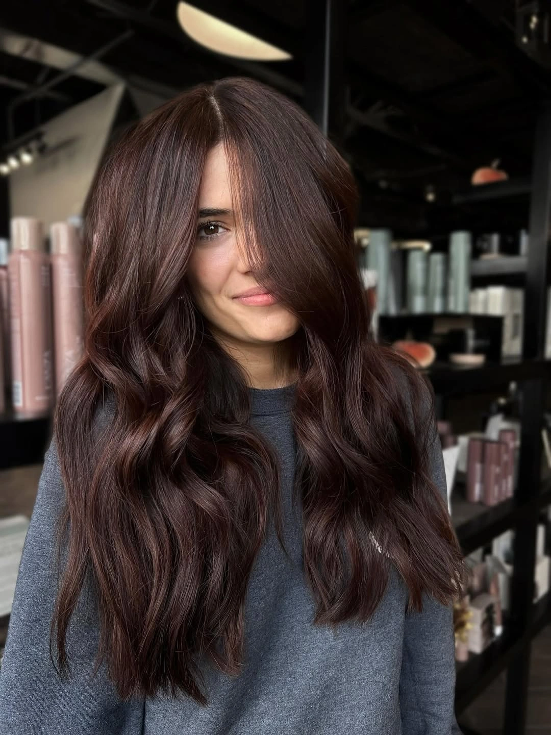 Long dark mahogany waves with rich burgundy-brown color