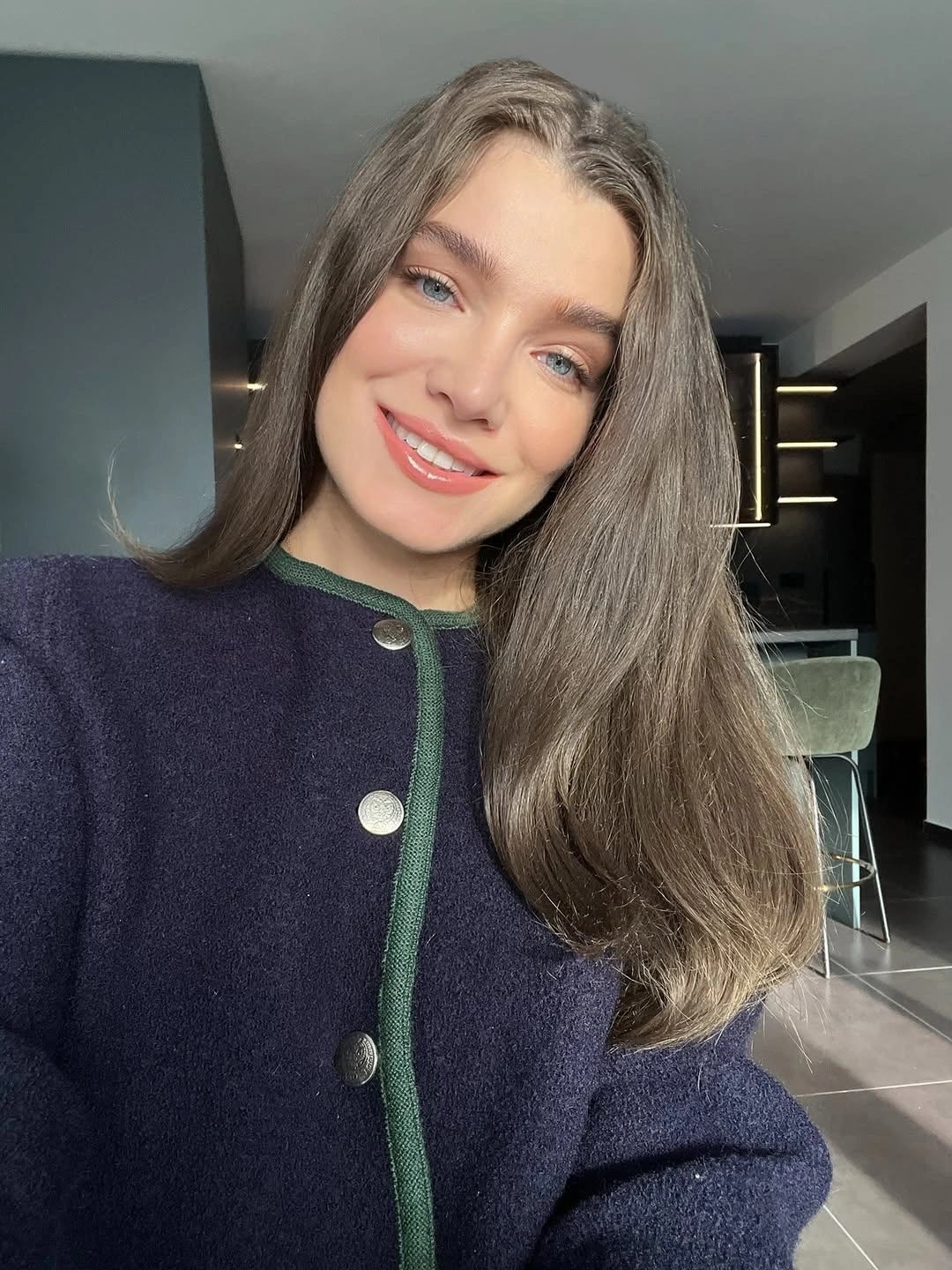 Long straight cool taupe-brown hair with muted reflections