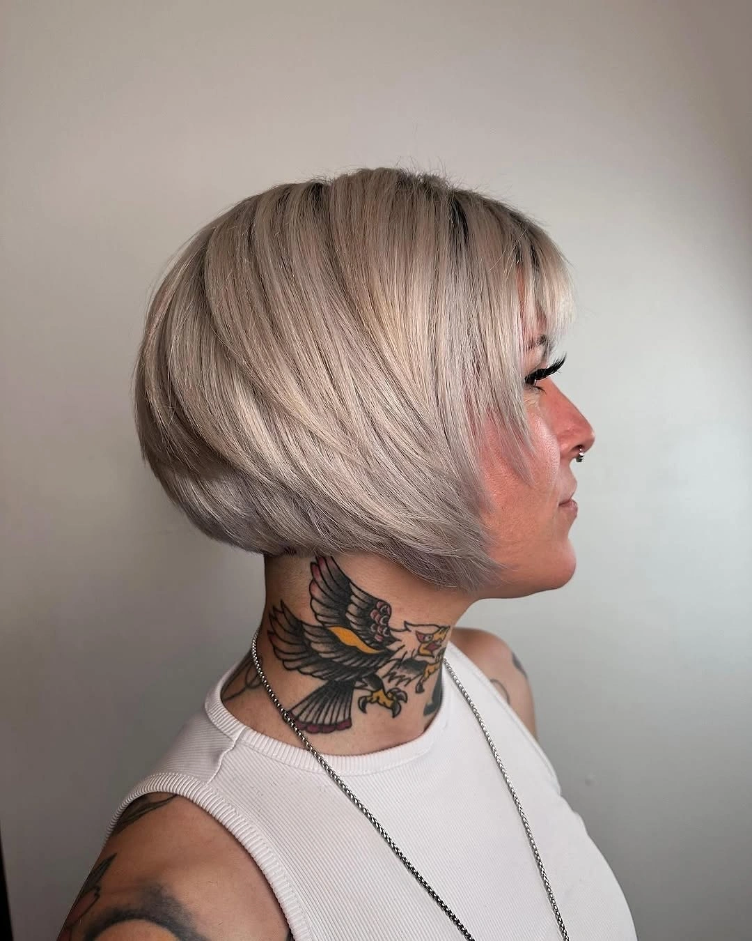 Silver-blonde graduated bob with short nape and angled front