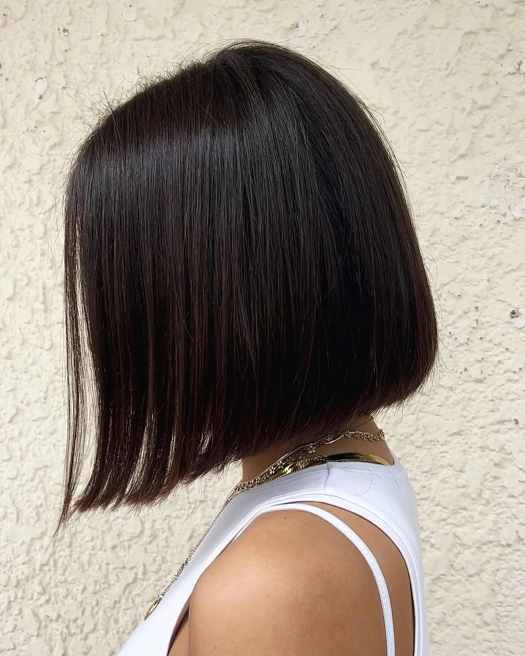 Sleek dark brunette bob with shorter back and longer front