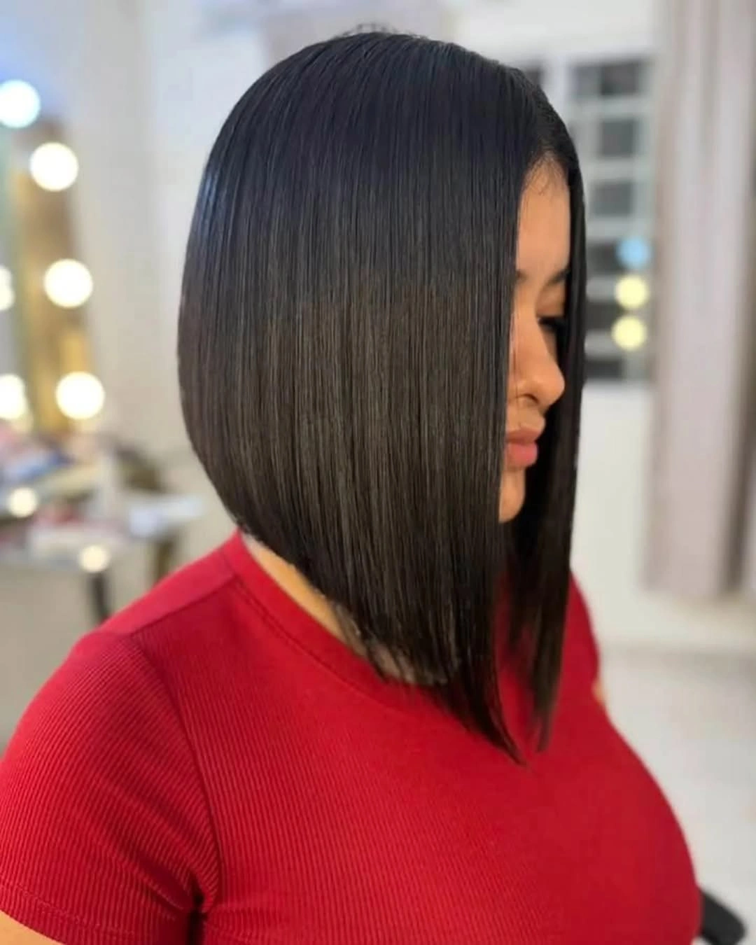 Glossy black A-line bob with dramatic longer front