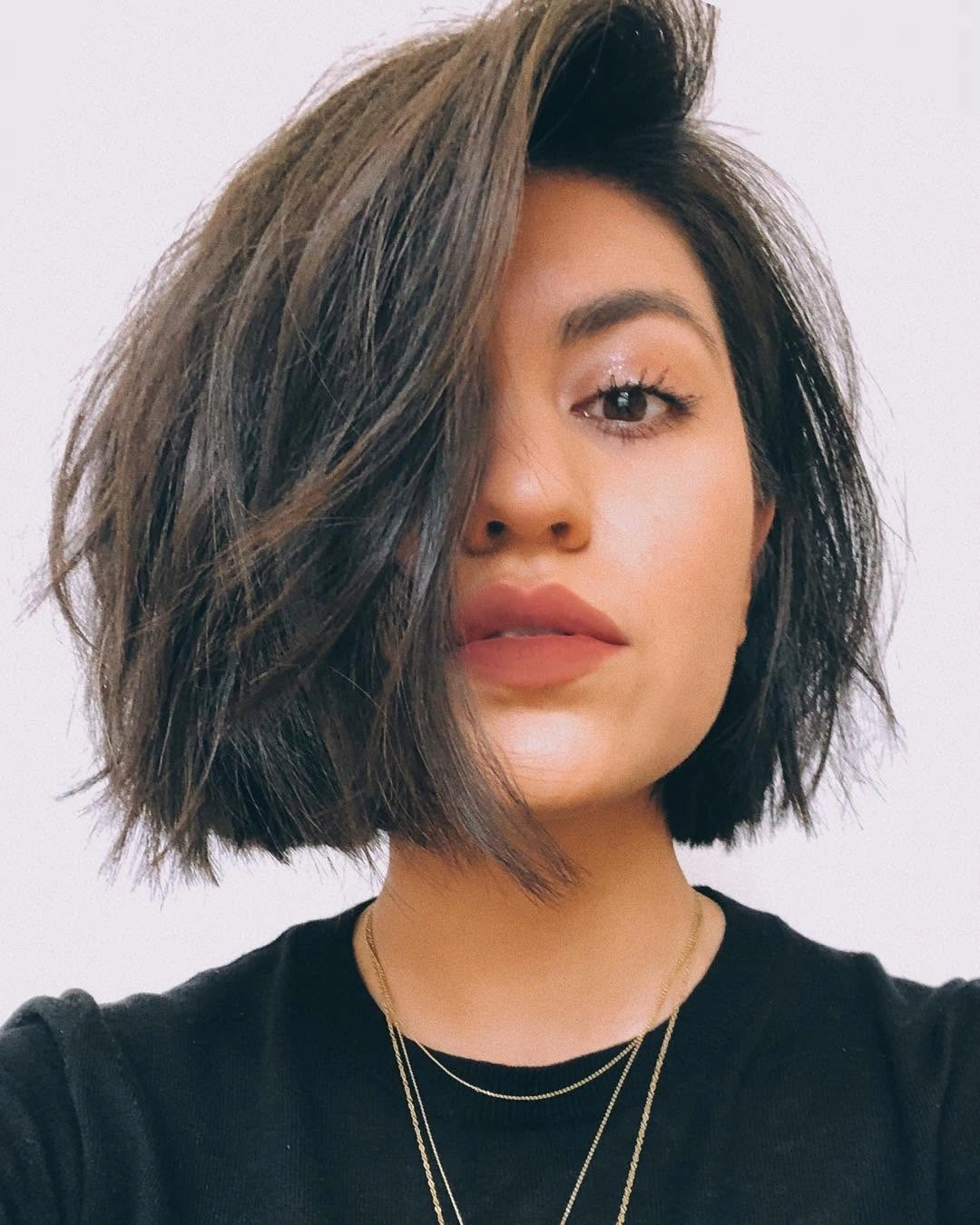 Dark side-parted bob with tousled piecey ends