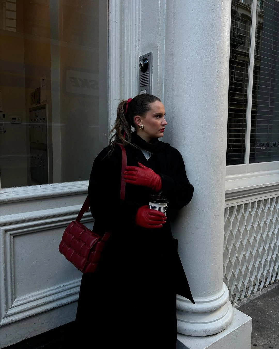 Black outer layer with red gloves and quilted red bag