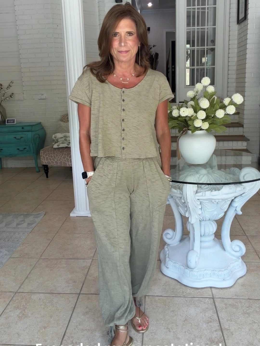 Woman wearing sage matching top pants and sandals