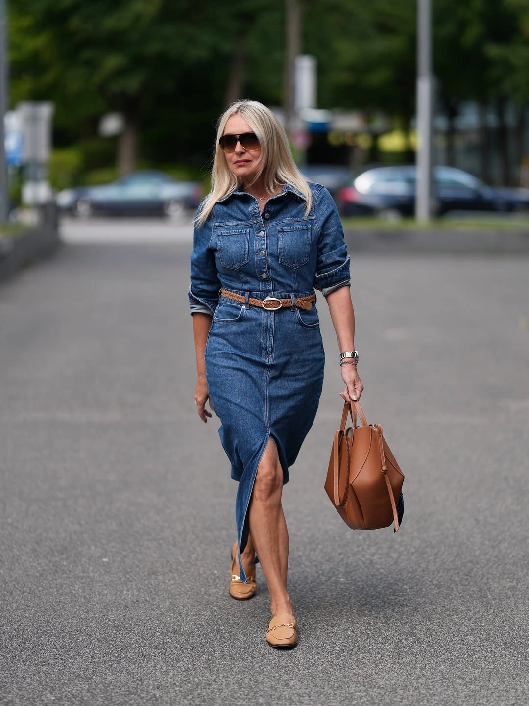 Woman in button front denim look with tan accessories