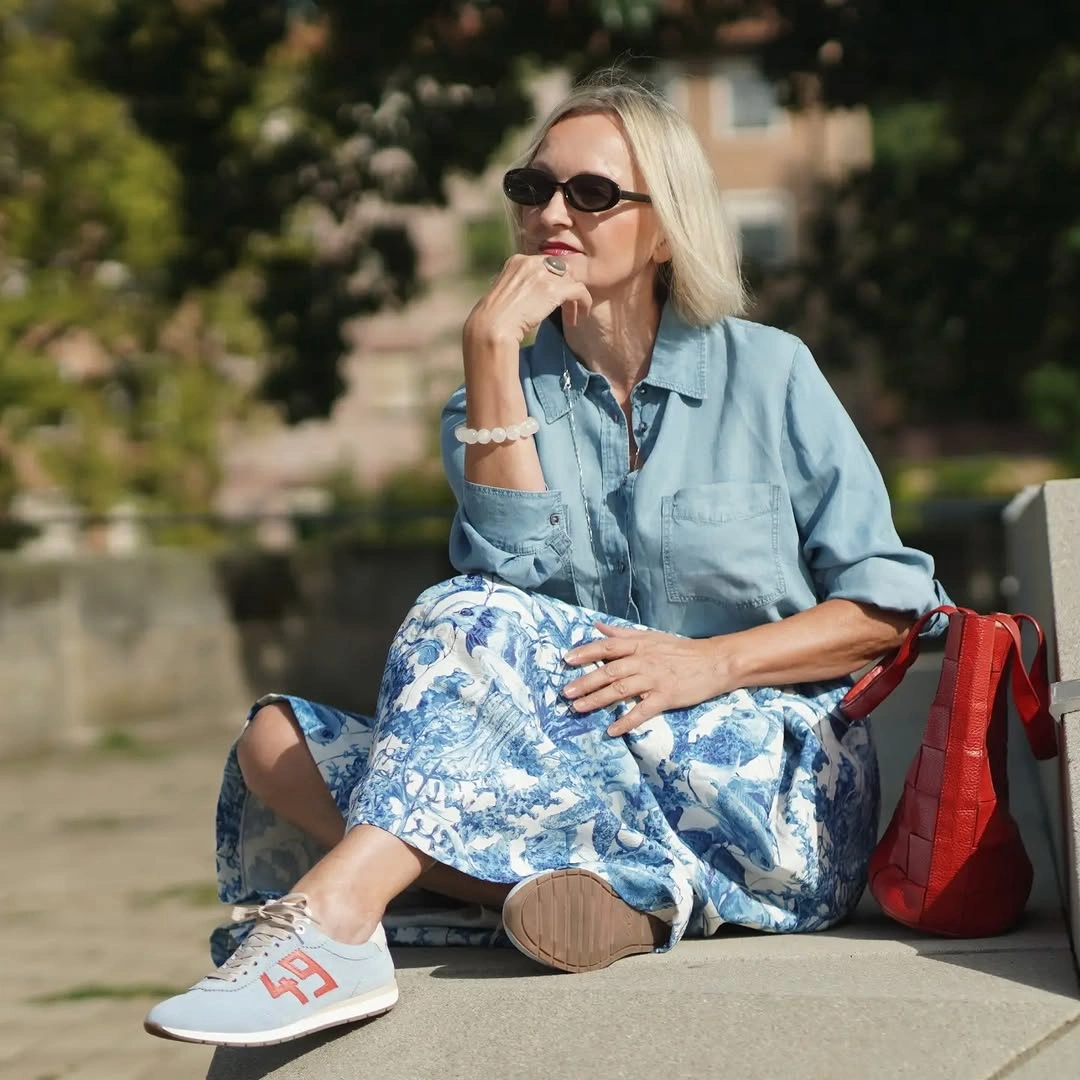 Light denim shirt with blue printed skirt and red tote