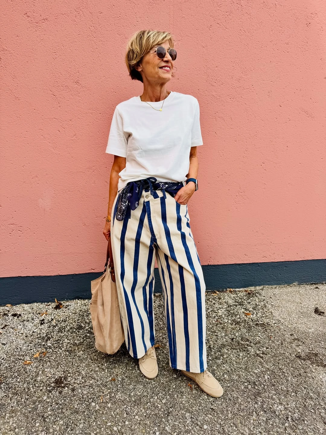 White T-shirt with blue striped wide pants and scarf