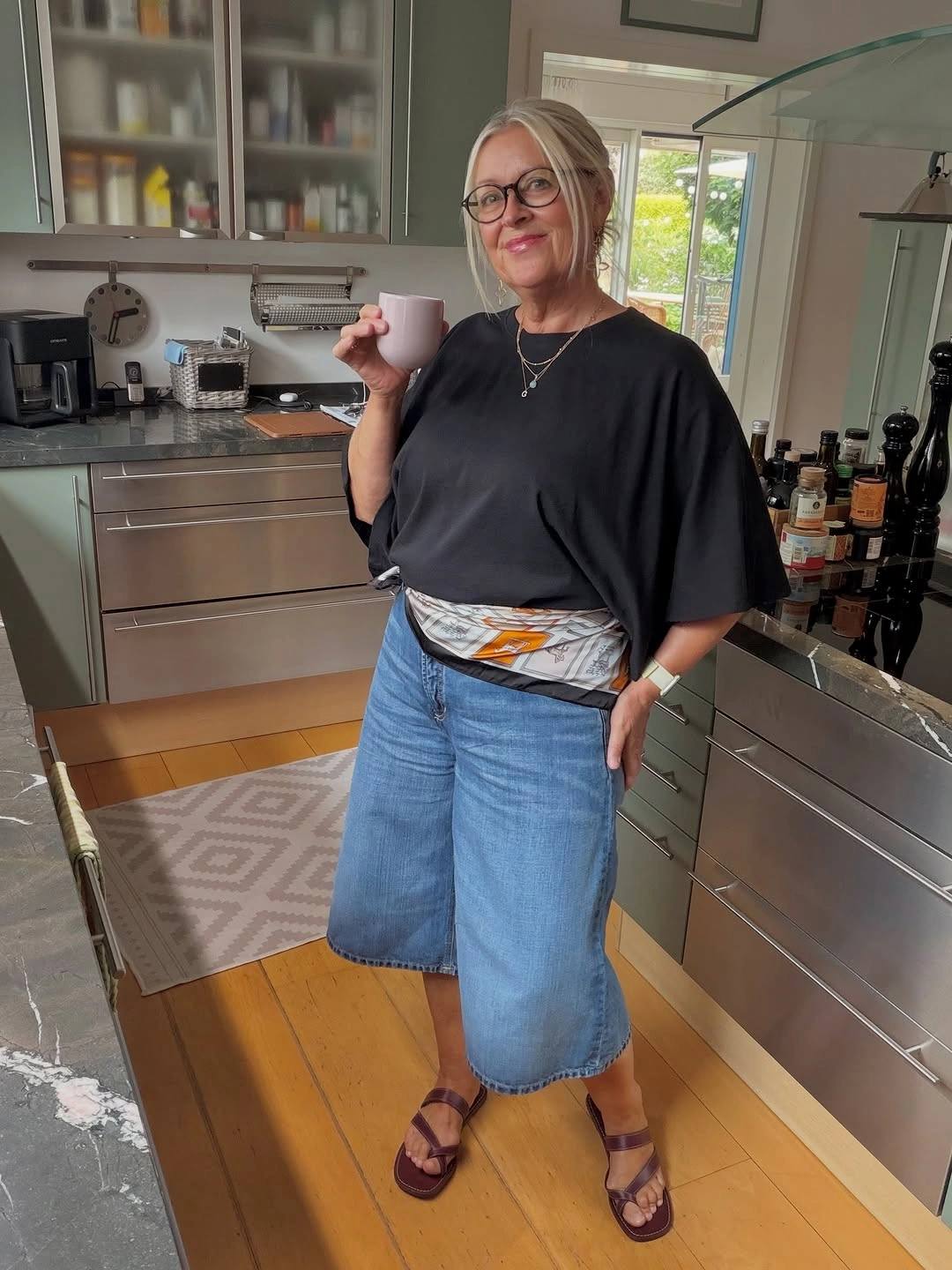 Black oversized T-shirt with denim culottes and scarf sash