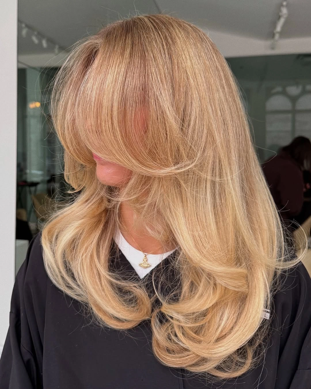 Long beige golden blonde with face-framing layers
