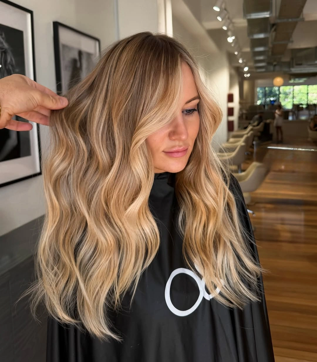 Long golden blonde waves with creamy face-framing sections