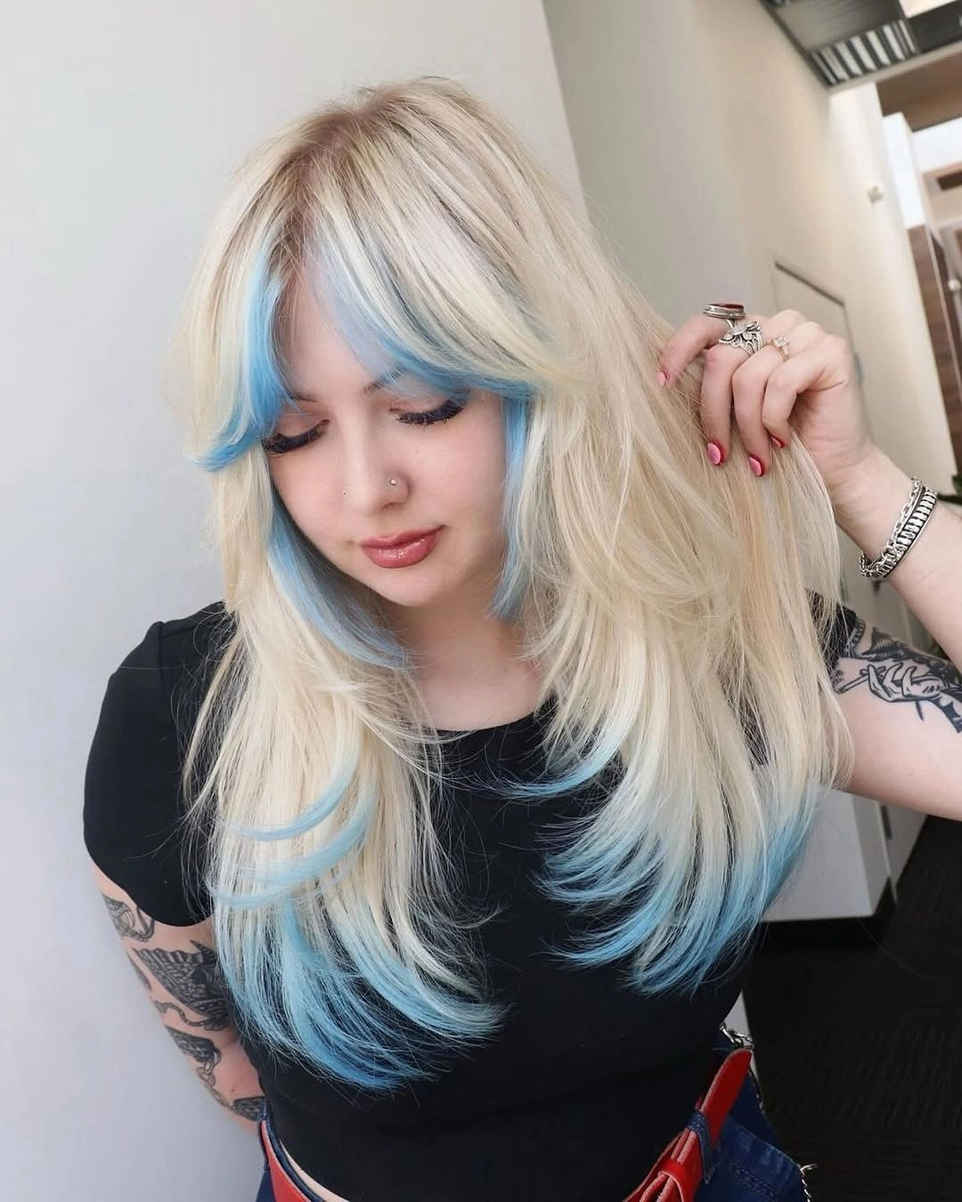 Pale blonde hair with vivid light blue accents