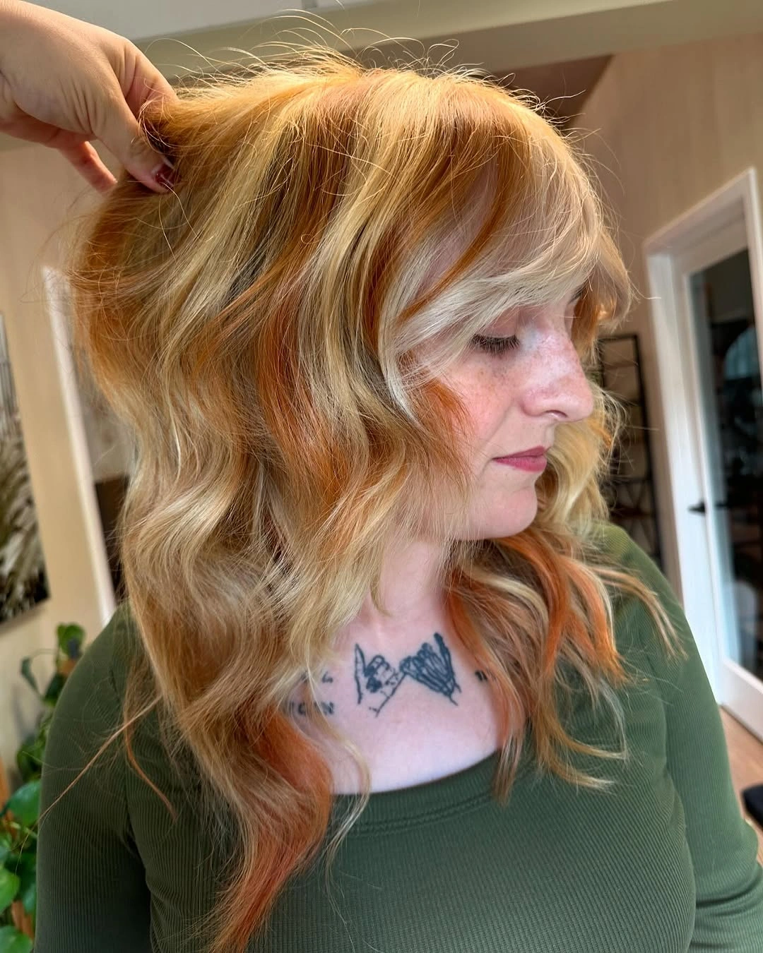 Strawberry copper waves with pale blonde face-framing sections