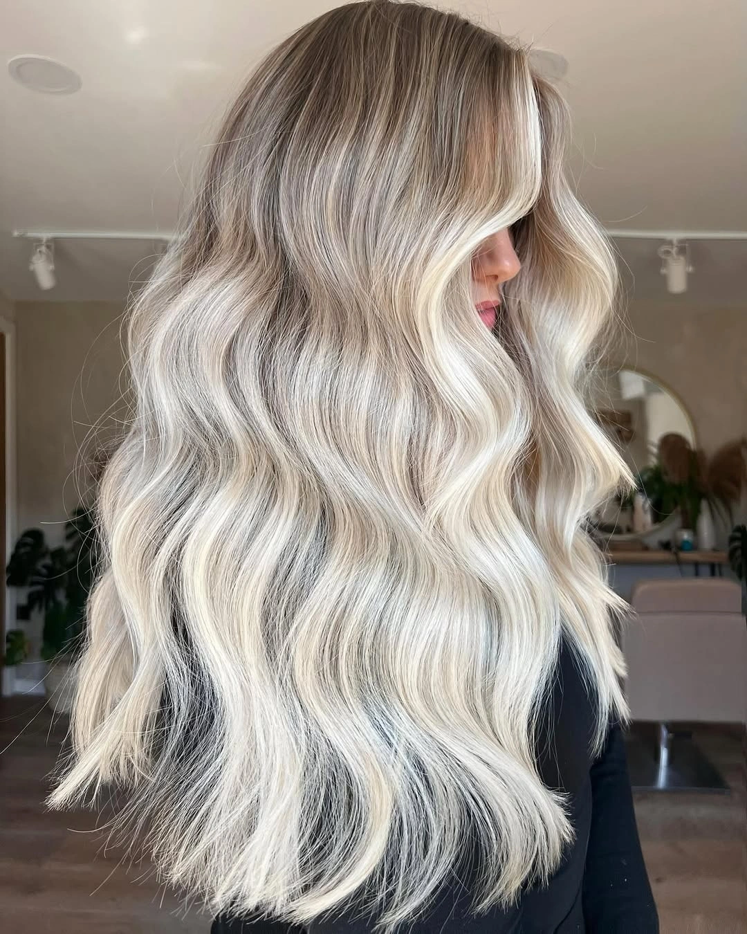 Long luminous icy blonde hair with broad pale waves