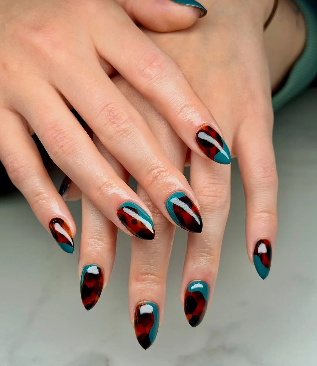 Almond nails with teal rust black curved panels