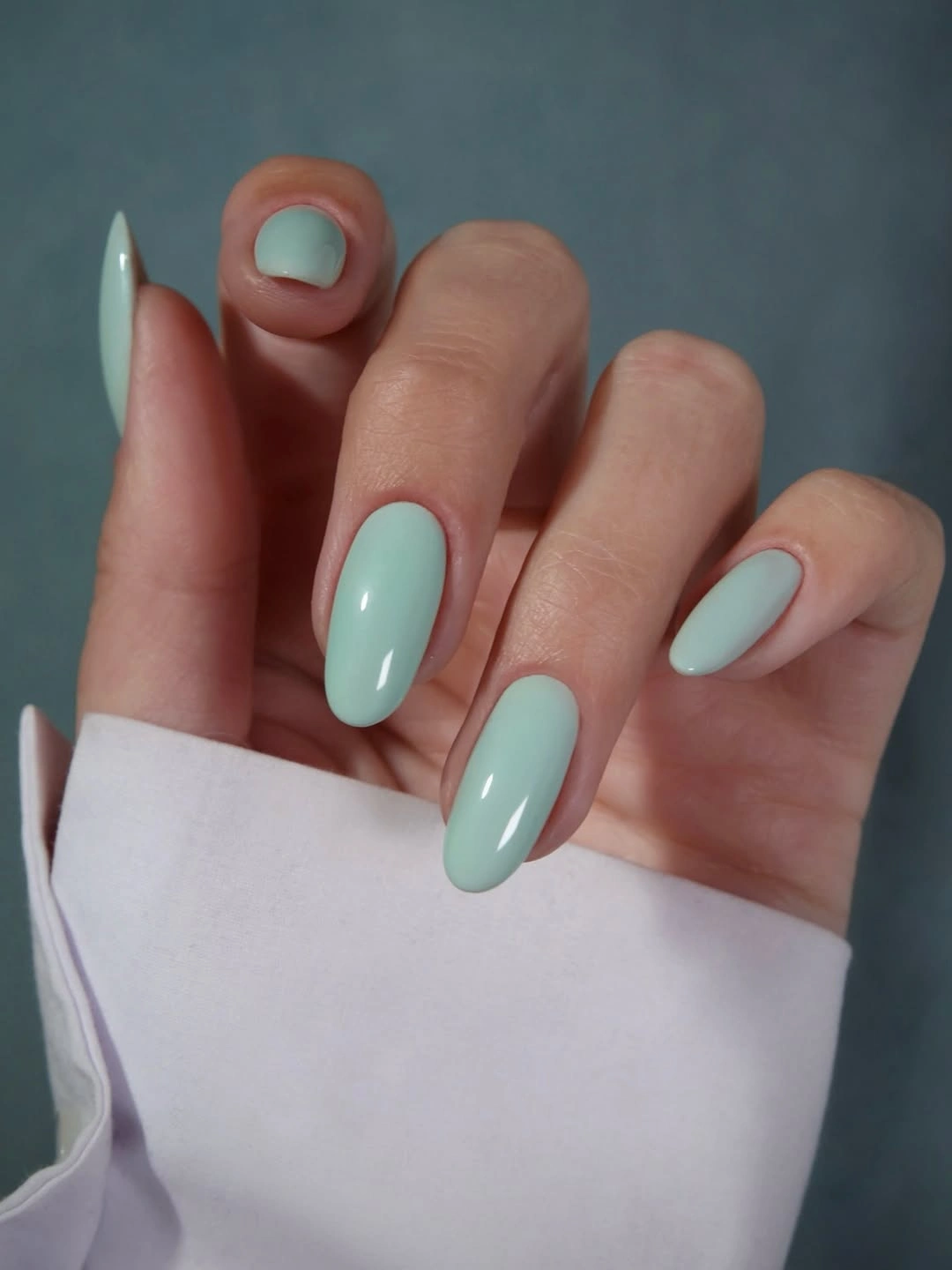 Soft mint blue nails with short and almond shapes
