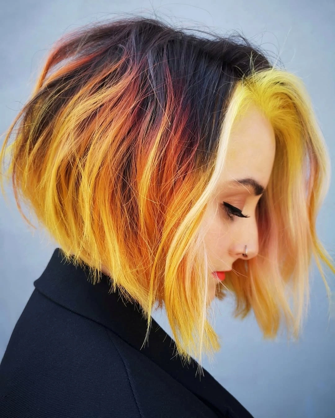 Short bob with yellow orange and blonde color panels