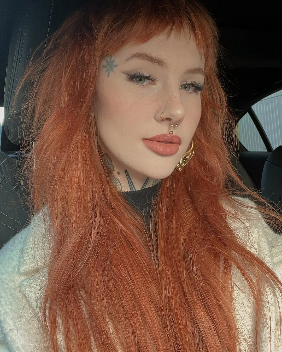 Long copper hair with soft bangs and face-framing pieces