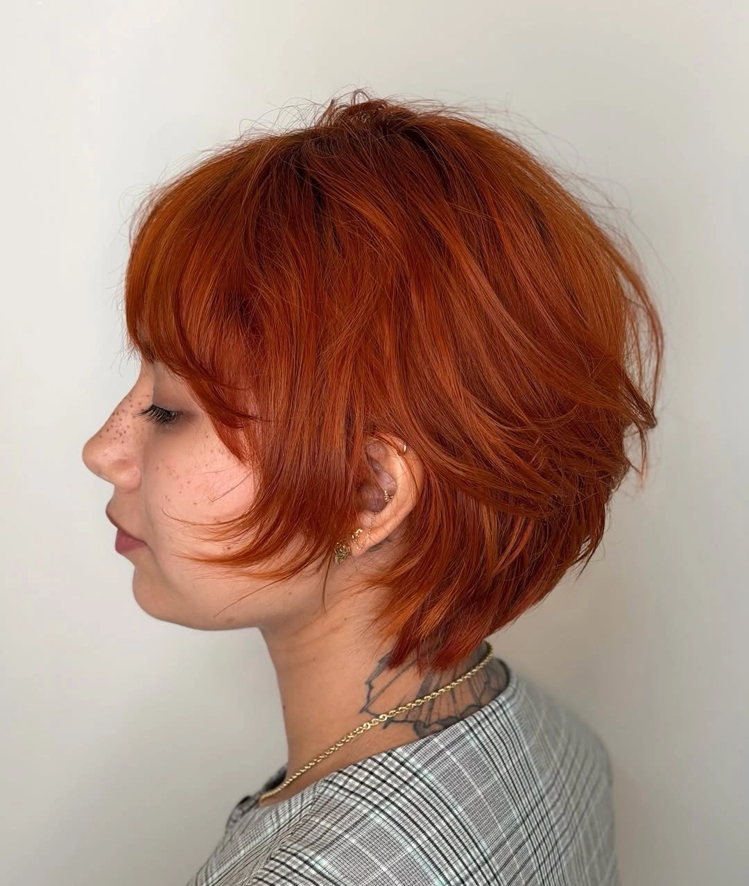 Short copper layered bob with rounded back volume