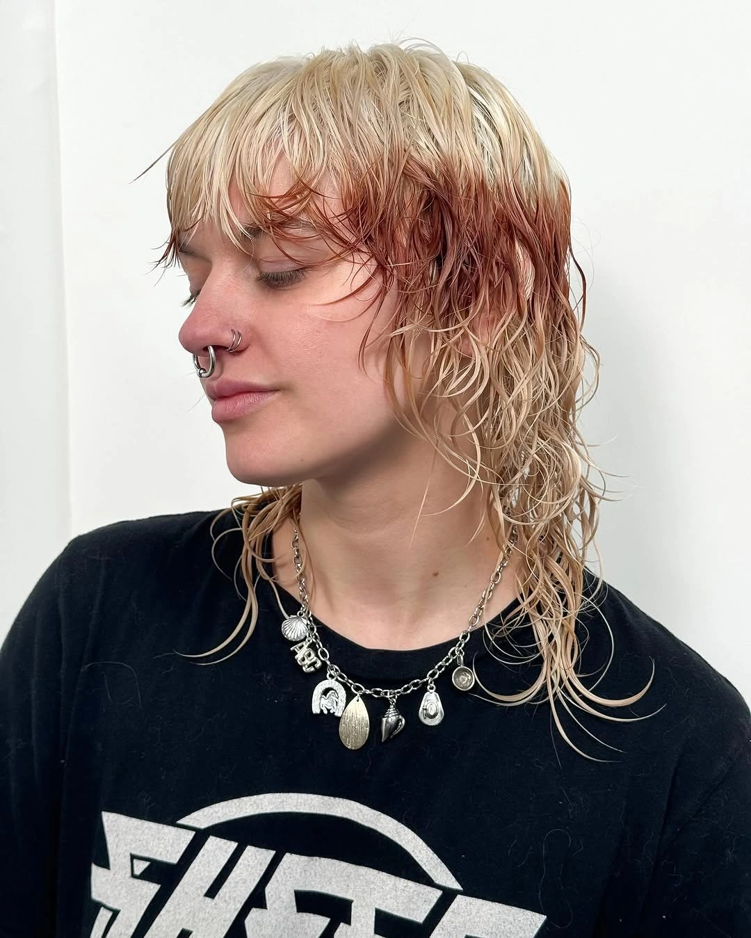 Wet-looking blonde shag-mullet with short fringe and long nape layers