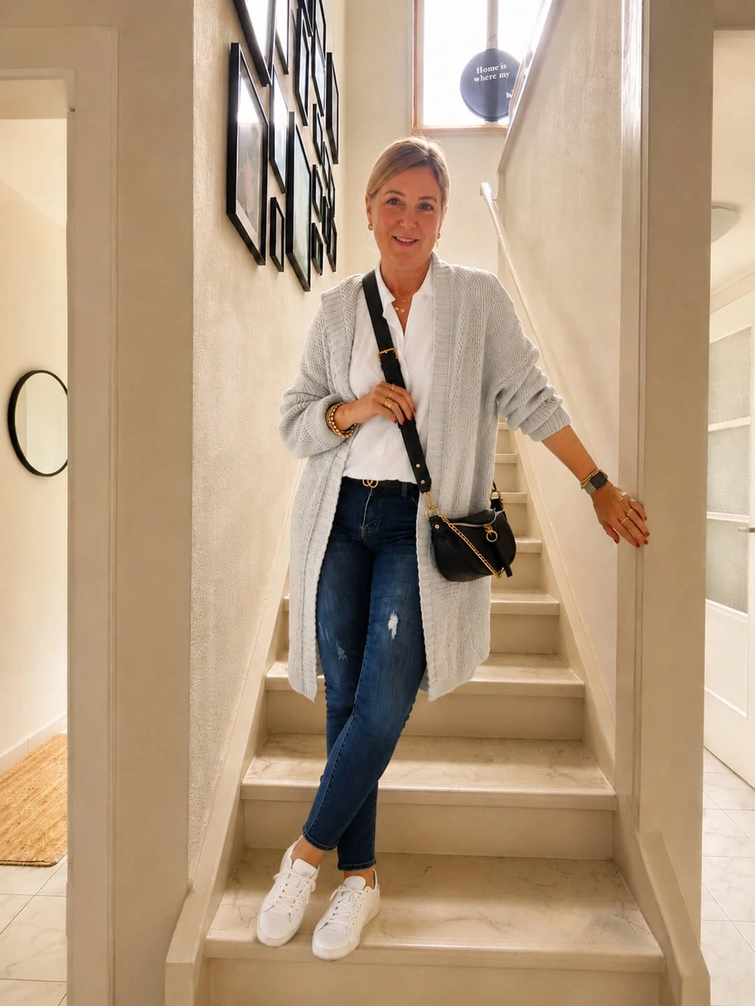 Pale cardigan with jeans, white sneakers and black crossbody