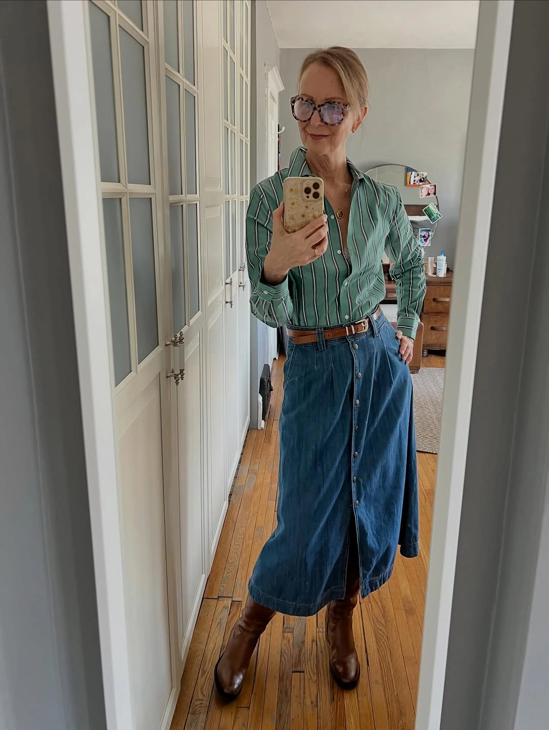 Green striped shirt with button-front denim skirt and boots
