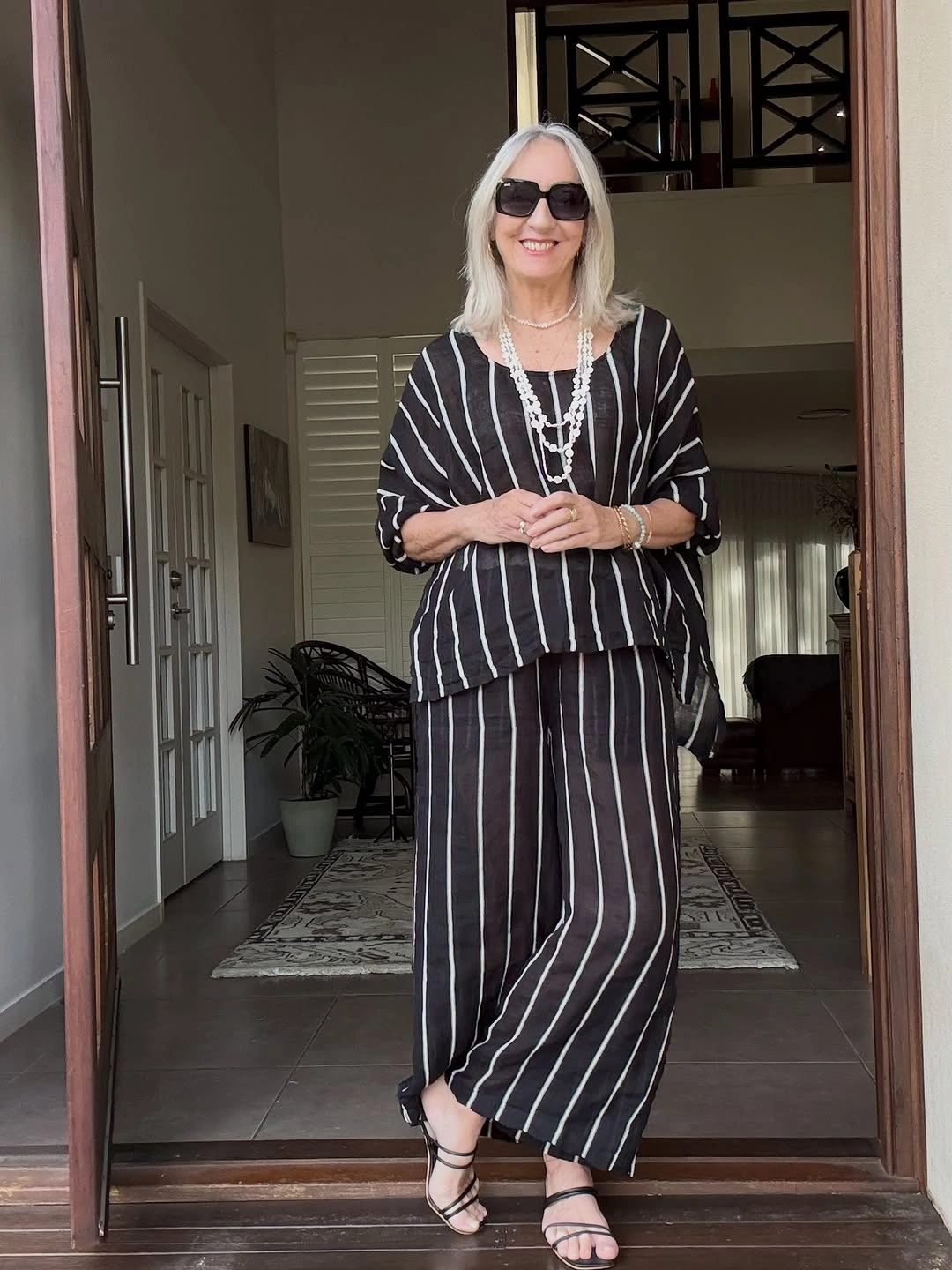 Loose black striped set with layered white necklaces