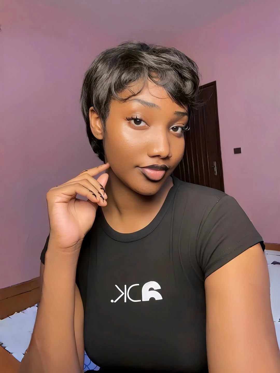 Short pixie haircut with wispy bangs and side pieces