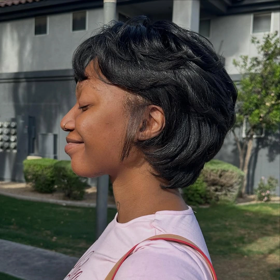 Layered short haircut with flipped ends in side profile