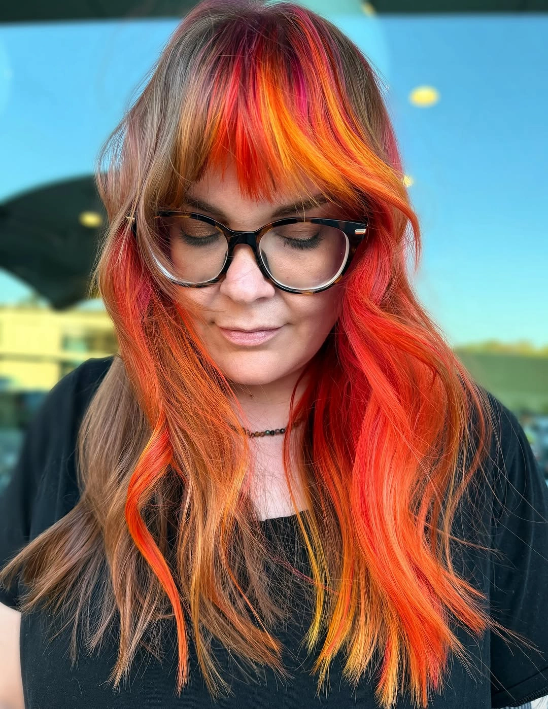 Shoulder-length waves with orange-red pieces and multicolor fringe