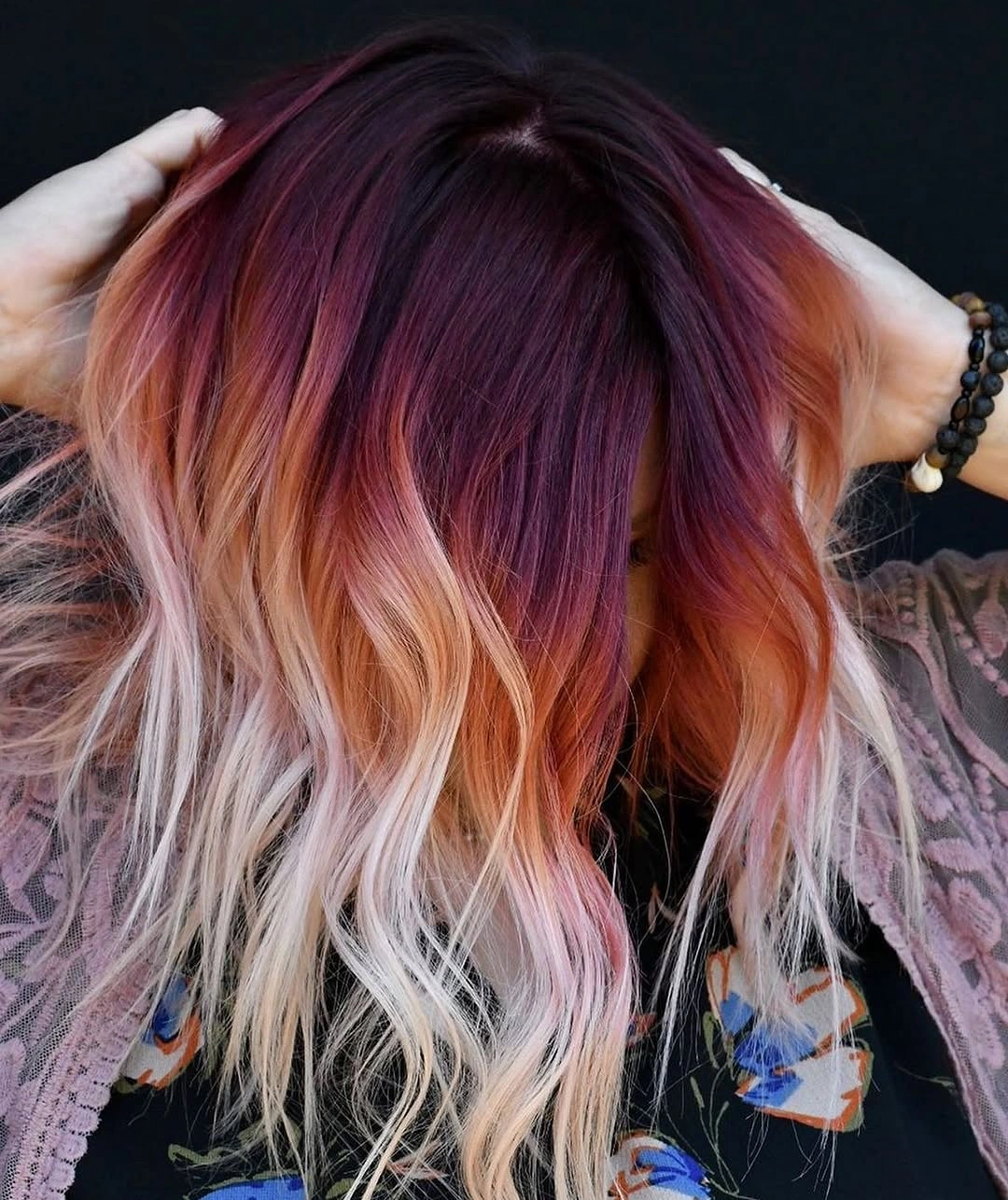 Long waves with plum roots orange middle and pale ends