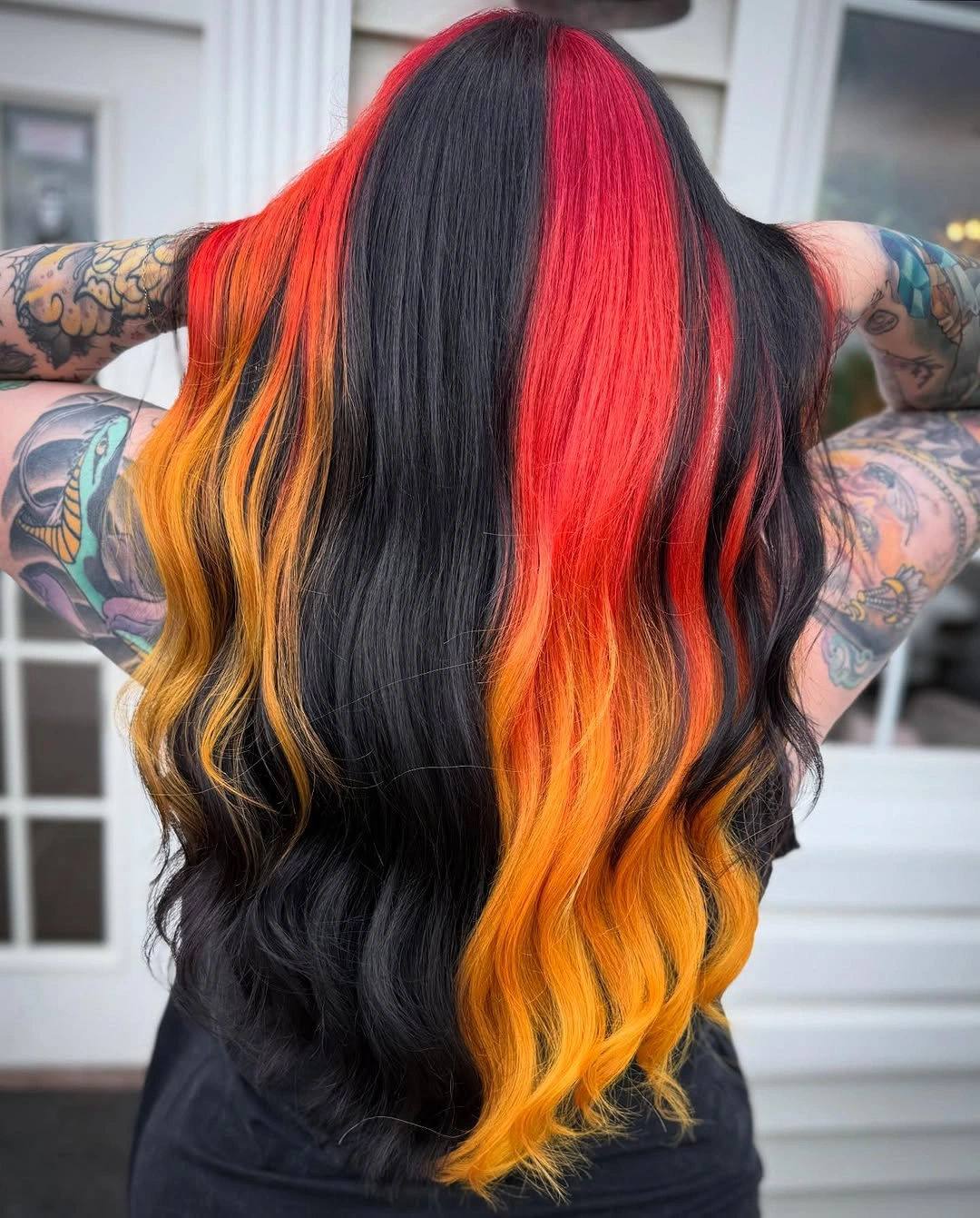 Long black waves with red and orange-yellow panels