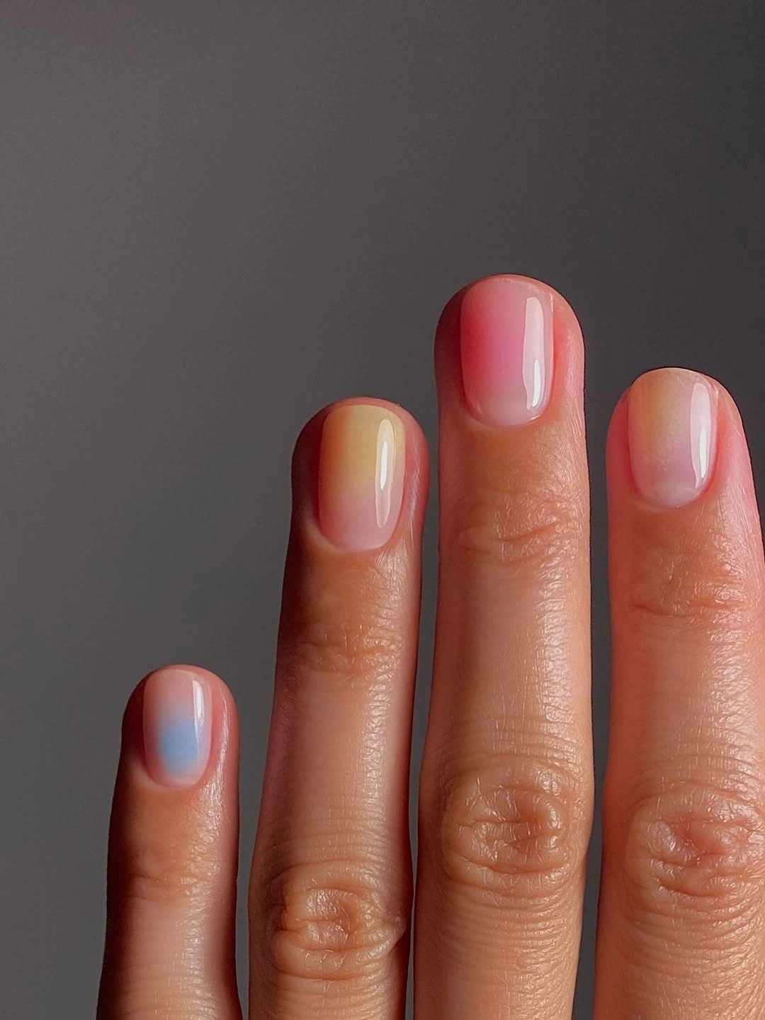 Very short nails with sheer pastel color washes