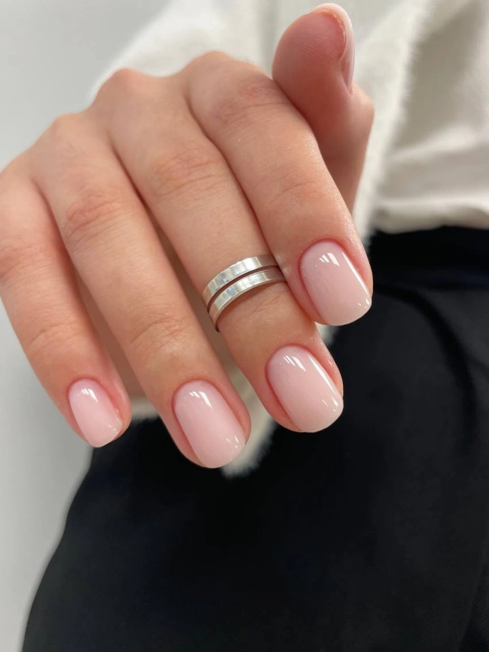 Milky pink short nails with silver rings
