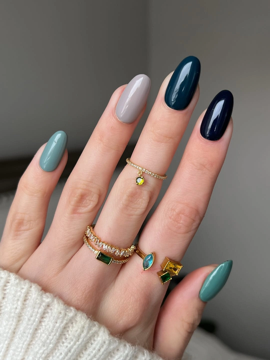 Long almond nails in aqua, gray, teal, and navy