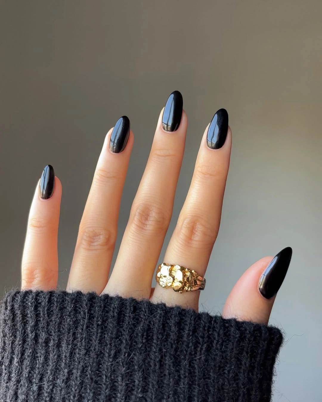 Long almond nails in high-gloss black polish