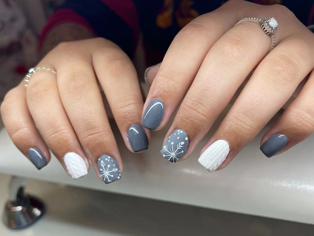 Short slate blue nails with white textured winter accents