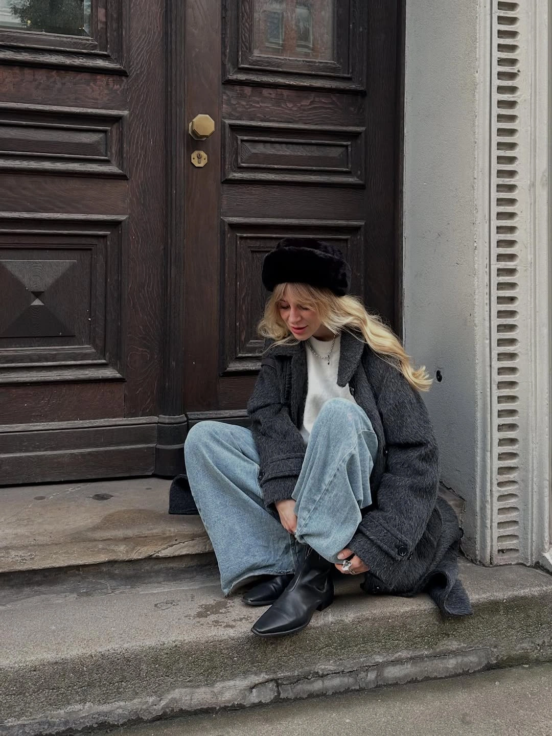 Charcoal fuzzy coat with pale jeans and pointed black boots