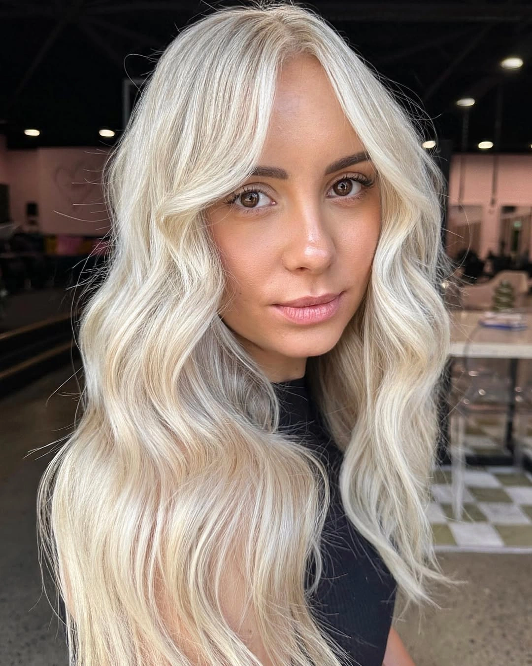 Long icy blonde waves with pale face-framing pieces