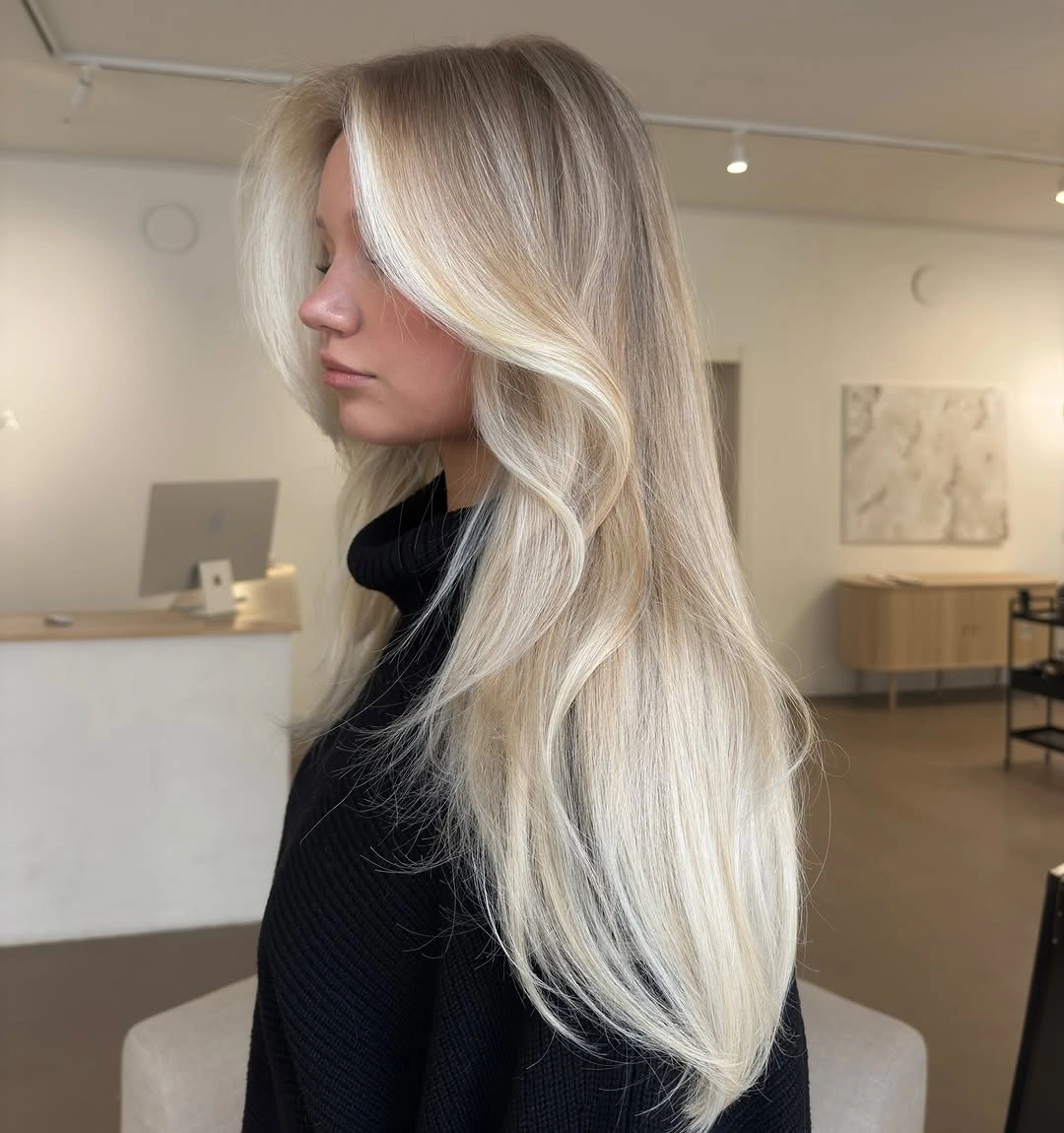 Long pale blonde hair with smooth sweeping front layer