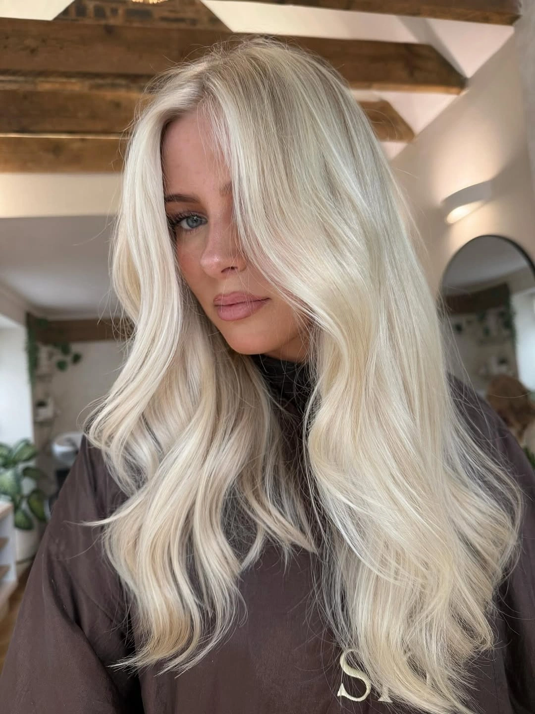 Very long icy blonde hair with loose waves